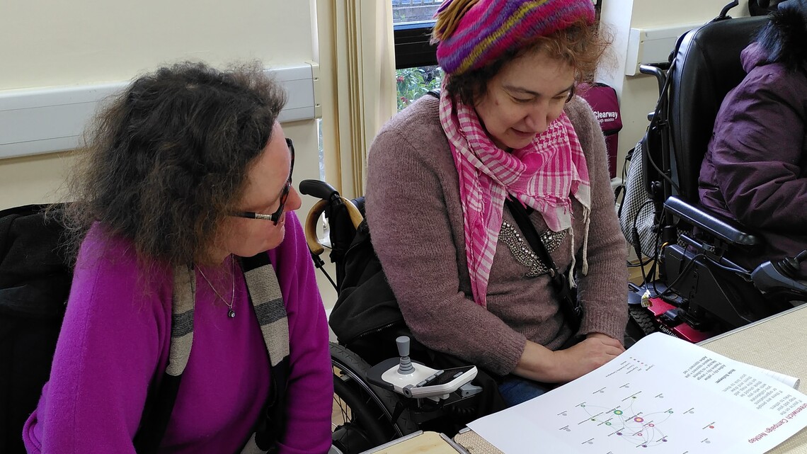 Two women looking at the A3 map 